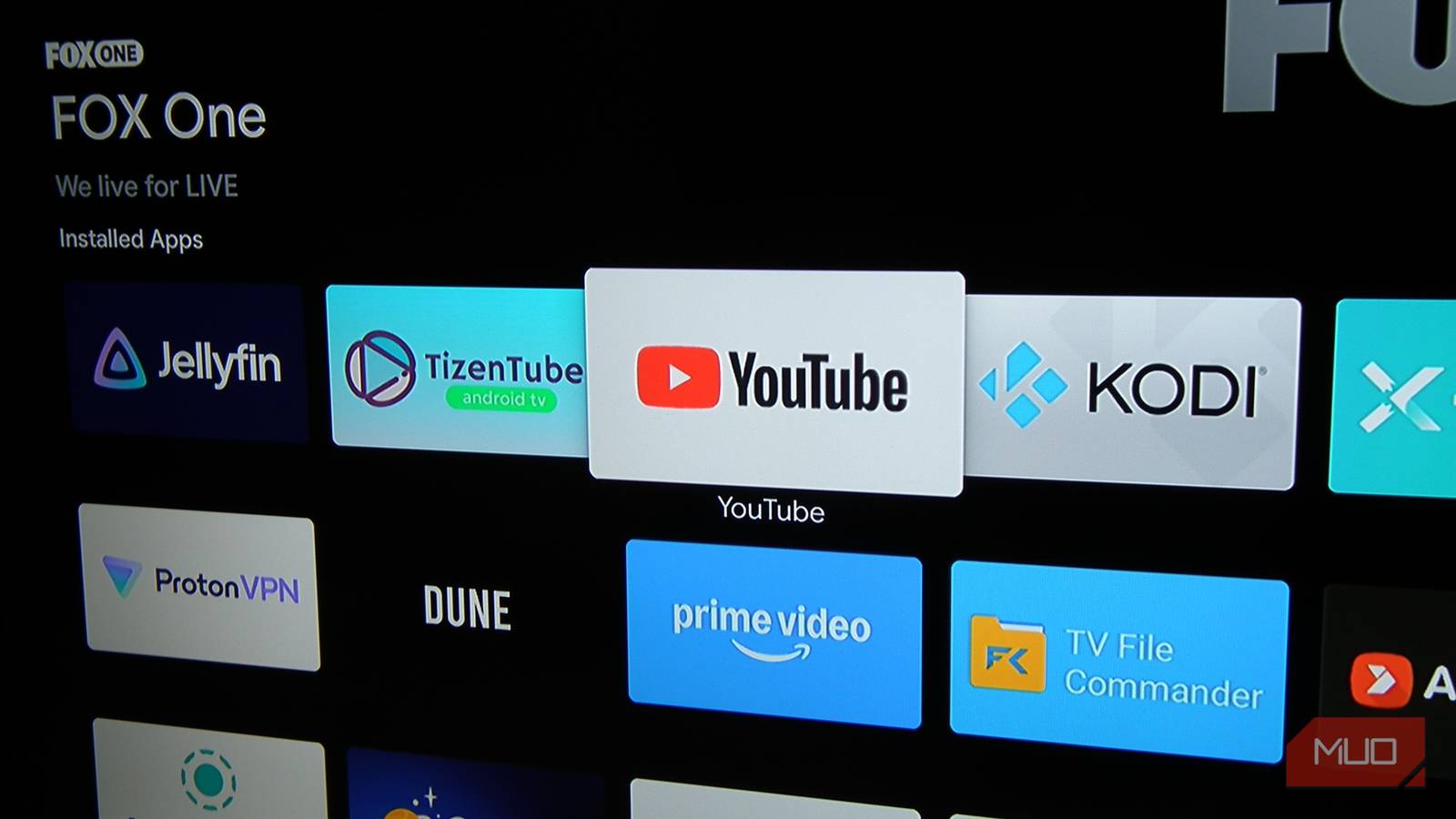a-smart-tv-running-android-tv-showing-the-youtube-app-logo-on-the-start-screen